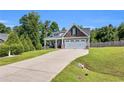 Lovely home featuring a well-manicured lawn and long driveway at 40 Savanah Ct, Sanford, NC 27332