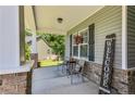 Cozy front porch with comfortable seating and a 'Welcome' sign at 40 Savanah Ct, Sanford, NC 27332