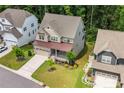 A beautiful two story home with manicured front yard landscaping at 405 Gilpin Way, Cary, NC 27519