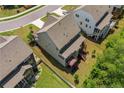 Rear aerial view featuring the deck, stairs, lawn and fenced in yard of this home at 405 Gilpin Way, Cary, NC 27519