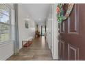 Entryway featuring wood-look floors, natural light, and views into the living areas at 453 Falls Creek Dr Dr, Spring Lake, NC 28390