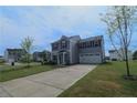 Stylish two-story house with a spacious driveway and a well-kept front lawn at 96 Cutty Way, Lillington, NC 27546