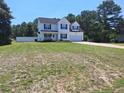 Charming two-story home with classic design and well-maintained lawn at 19 Ribbon Oak Ct, Sanford, NC 27332