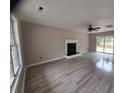 The spacious living room boasts modern flooring and a cozy fireplace feature at 19 Ribbon Oak Ct, Sanford, NC 27332