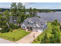Beautiful two-story home with a manicured lawn and lake view at 87 Pelican Ct, Sanford, NC 27332