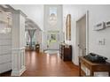 Bright foyer with hardwood floors and a beautiful chandelier at 87 Pelican Ct, Sanford, NC 27332
