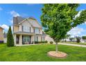Charming home with lush green lawn, inviting porch, and mature landscaping at 89 Revolutionary Rd, Cameron, NC 28326