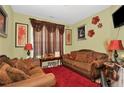 Cozy living room with plush seating, warm lighting, and decorative accents at 89 Revolutionary Rd, Cameron, NC 28326