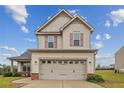 Beautiful two-story home with a two-car garage and classic architectural details at 110 Summerseat Way, Bunnlevel, NC 28323