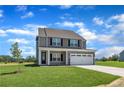 Attractive two-story home with a covered entry and attached two car garage at 136 Camp Rock Rd, Lillington, NC 27546