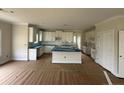 Spacious kitchen with white cabinets, subway tile backsplash, and center island at 136 Camp Rock Rd, Lillington, NC 27546