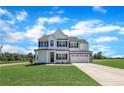Charming two-story home featuring a stone-accented facade, black shutters, and a well-manicured lawn at 158 Camp Rock Rd, Lillington, NC 27546
