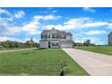 Well-maintained two-story home with a long driveway and spacious front lawn at 158 Camp Rock Rd, Lillington, NC 27546