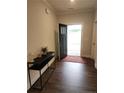 Inviting entryway featuring dark hardwood floors and a modern console table, offering a stylish welcome at 207 Southwick Ct, Sanford, NC 27332