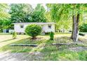 A charming single-story home with a well-manicured lawn and a welcoming entrance at 2327 Dewitt St, Sanford, NC 27330