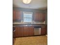 Functional kitchen with stainless steel appliances and ample counter space at 1824 Ponderosa Trl, Cameron, NC 28326