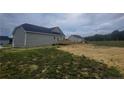 Newly built home with backyard, wooden deck and space for outdoor activities at 24 Roll Tide Ct, Angier, NC 27501