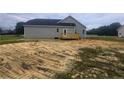 New construction with a wooden deck, offering a relaxing outdoor living space at 24 Roll Tide Ct, Angier, NC 27501