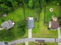 Aerial view of a home showcasing its layout, spacious yard, and proximity to neighborhood amenities at 265 Tactical Dr, Bunnlevel, NC 28323