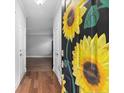 View of the foyer showing the entry door with its custom sunflower painting at 265 Tactical Dr, Bunnlevel, NC 28323