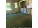 Inviting living room with lots of natural light and washer/dryer hookups at 5028 Valley View Dr, Sanford, NC 27330
