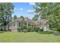 Brick and vinyl home with a well-kept front yard and charming covered porch at 110 Riviera Ln, Sanford, NC 27332