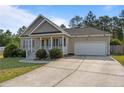 Attractive single-Gathering home with a green lawn, manicured landscaping, and a welcoming covered porch at 187 Gunner Ct, Broadway, NC 27505