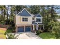 Charming two-story home with a manicured lawn, two-car garage, and mature landscaping at 55 High Green Pt, Cameron, NC 28326