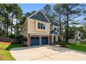 Charming two-story home with a manicured lawn, two-car garage, and mature landscaping at 55 High Green Pt, Cameron, NC 28326