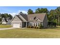 Beautiful single-Gathering home with a well-manicured lawn and a convenient two-car garage at 139 Ravens Row Dr, Benson, NC 27504