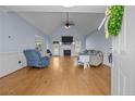 Bright living room boasts vaulted ceilings, hardwood floors, fireplace, and a cozy atmosphere at 140 Bagley Ln, Dunn, NC 28334