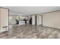 Open-concept living area showcasing modern floors and abundant natural light at 2088 Heritage Way, Cameron, NC 28326