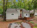 Quaint single-Gathering home with mature landscaping and a brick privacy wall at 968 S Bay Dr, Sanford, NC 27332