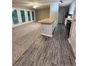 Open-concept kitchen and living area, showcasing modern appliances and a breakfast bar at 1321 Park Glen Dr # 202, Raleigh, NC 27610