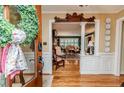 Inviting foyer with hardwood floors, decorative molding, and view into the living spaces at 1409 Brentwood Pl, Sanford, NC 27330