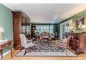 Cozy living room featuring hardwood floors, stylish furniture, and ample natural light at 1409 Brentwood Pl, Sanford, NC 27330