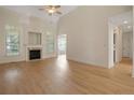 Bright living room boasting wood floors, fireplace, large windows, and high ceilings at 196 Leaning Pine Cir, Spring Lake, NC 28390