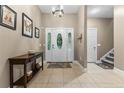 Elegant foyer boasting tile flooring, console table, and a decorative front door at 3046 Creek Run, Sanford, NC 27332
