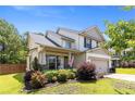 Beautiful two-story home featuring a covered porch, well-maintained landscaping, and a two-car garage at 18 Hallow Oak St, Spring Lake, NC 28390