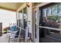 Cozy front porch with rocking chairs and ample natural light streaming through the windows at 18 Hallow Oak St, Spring Lake, NC 28390
