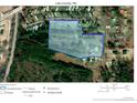 Aerial view of the property with a plat map overlay showing the parcel boundaries and street access at 222 St. Andrews Church Rd, Sanford, NC 27332