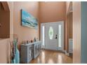 Bright foyer with hardwood floors, a console table, and stylish decor accents at 416 Kentucky Derby Ln, Lillington, NC 27546
