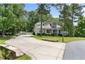 Long driveway leading to a well-maintained home with lush landscaping at 951 Whispering Pines Dr, Spring Lake, NC 28390