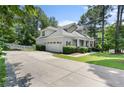 Spacious garage and extended driveway of a well-manicured two-story home at 951 Whispering Pines Dr, Spring Lake, NC 28390