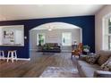 Spacious living room boasts hardwood floors, comfortable seating, and an open archway at 108 Pine St, Dunn, NC 28334