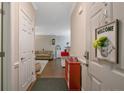 Inviting entryway with wood floors and a glimpse into a cozy living room with comfortable furnishings at 291 Gallery Dr # 104, Spring Lake, NC 28390