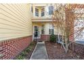 Charming front entrance with a 'Welcome' sign, brick accents, and an inviting entryway at 82 Pine Hawk Dr, Spring Lake, NC 28390