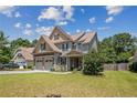 Lovely two-story home with two-car garage on a well-maintained lawn at 50 Turner Mathews Ct, Spring Lake, NC 28390