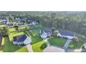 Aerial view of a quiet residential neighborhood with tree-lined streets and well-kept lawns at 109 Shelby St, Spring Lake, NC 28390