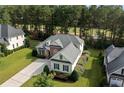 Aerial view of well-maintained home with manicured landscaping and driveway at 259 Rolling Pines Dr, Spring Lake, NC 28390